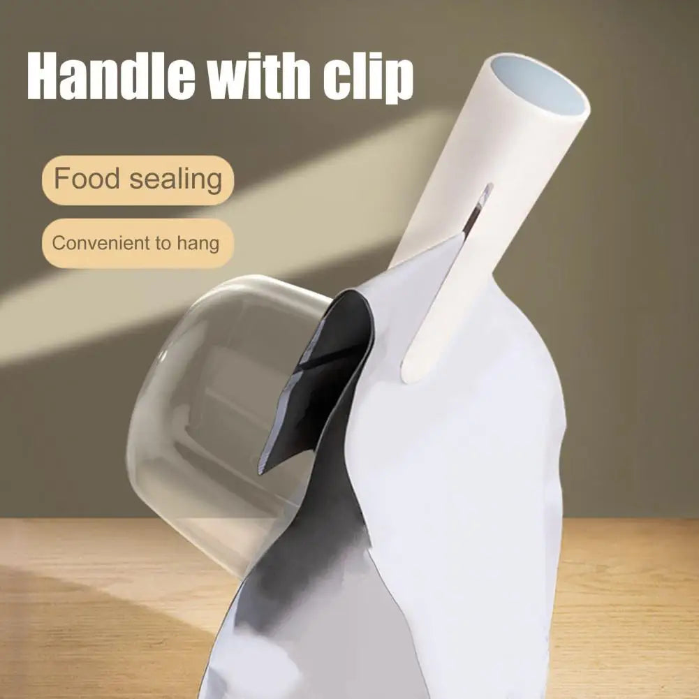 A white pet food measuring scoop with a clip is shown next to a transparent bowl, highlighting its use for food sealing and h
