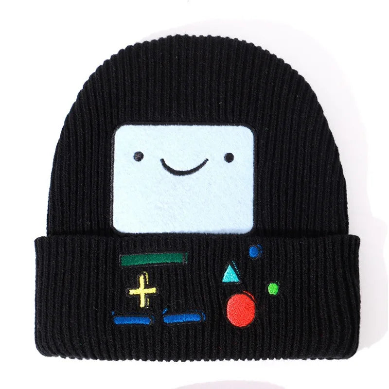 Black knitted beanie hat featuring a white cartoon face and colorful embroidered symbols on the cuff