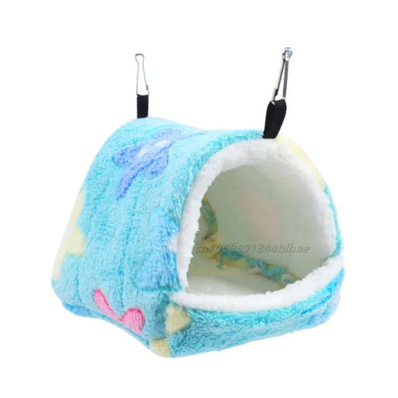 A light blue and white fleece pet nest bed with a handle for carrying