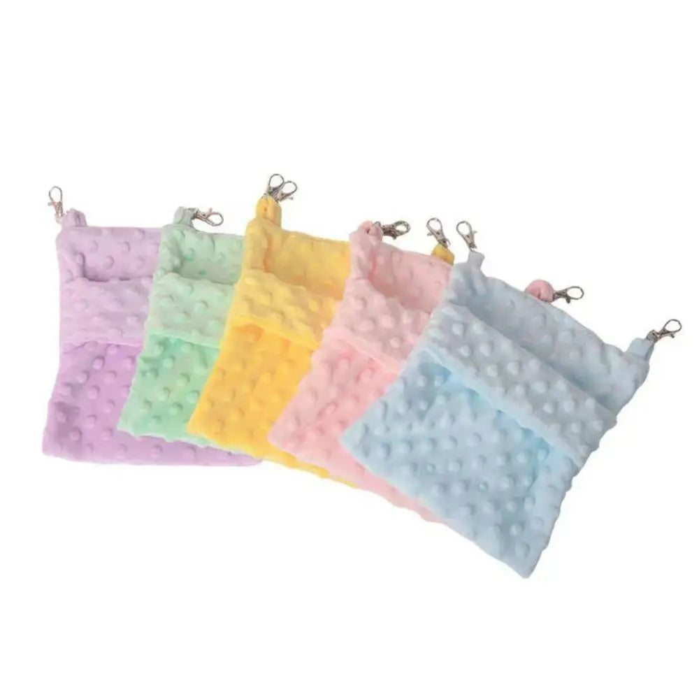 A collection of colorful, soft, fuzzy hanging sleeping bags for small pets.
