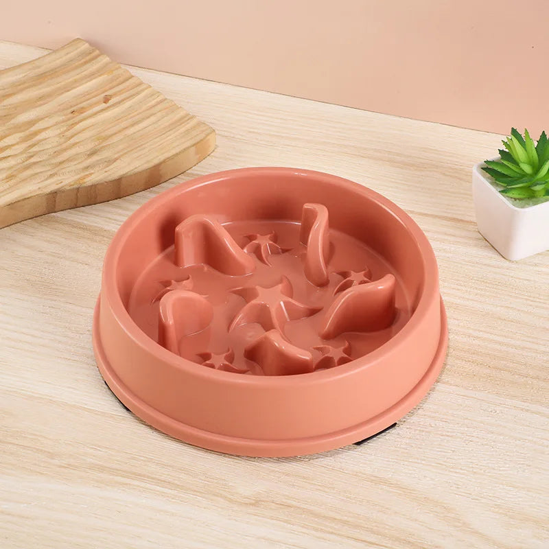 A terracotta-colored anti-slip slow feeder bowl for small dogs and cats resting on a light wooden surface.