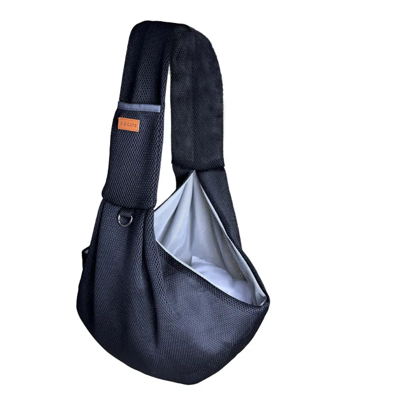 Black breathable mesh dog carrier crossbody bag with a gray accent tag