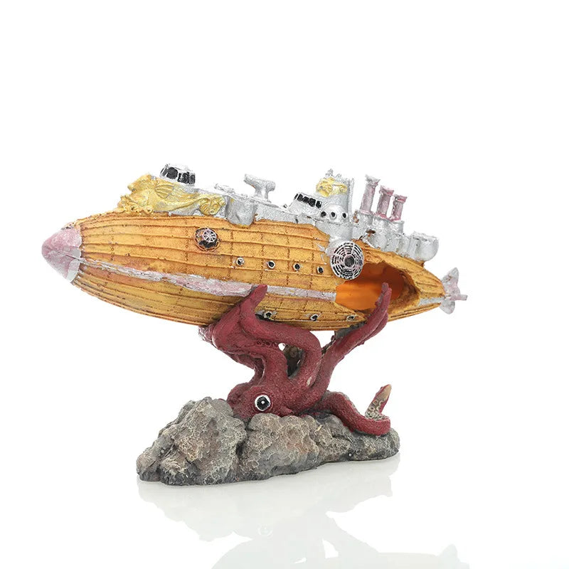 A model of a sunken submarine with a hideout cave emerging from a rock base.