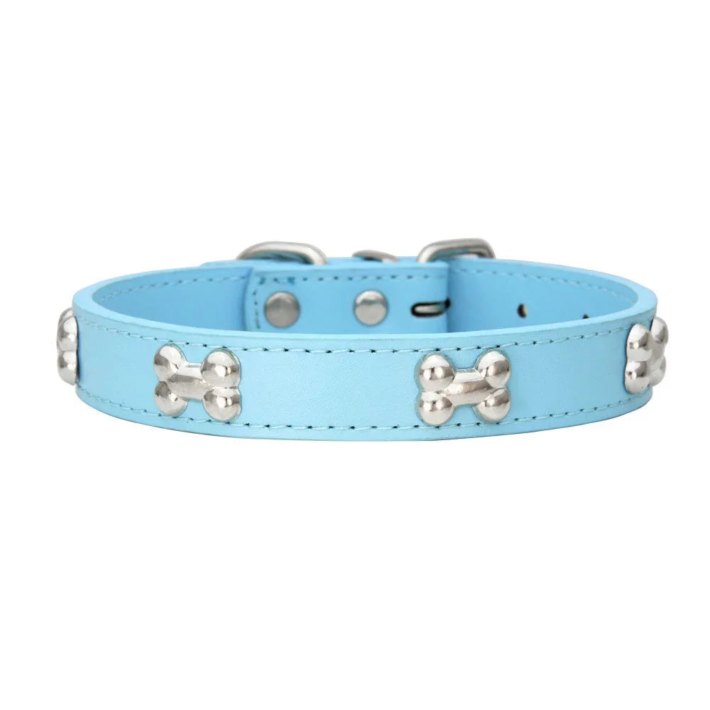 Light blue padded leather dog collar with silver bone rivets and a padded neck strap.