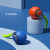 Two blue and orange interactive cat toy balls are shown on a light blue surface.