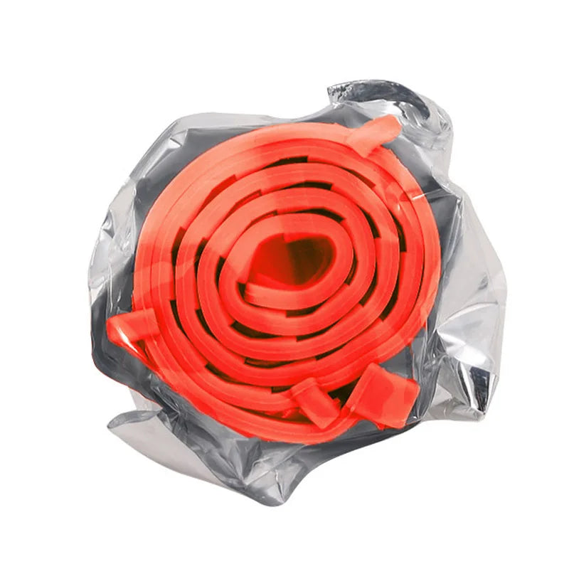 A roll of bright orange silicone pet collar for small dogs and cats, packaged in clear plastic.