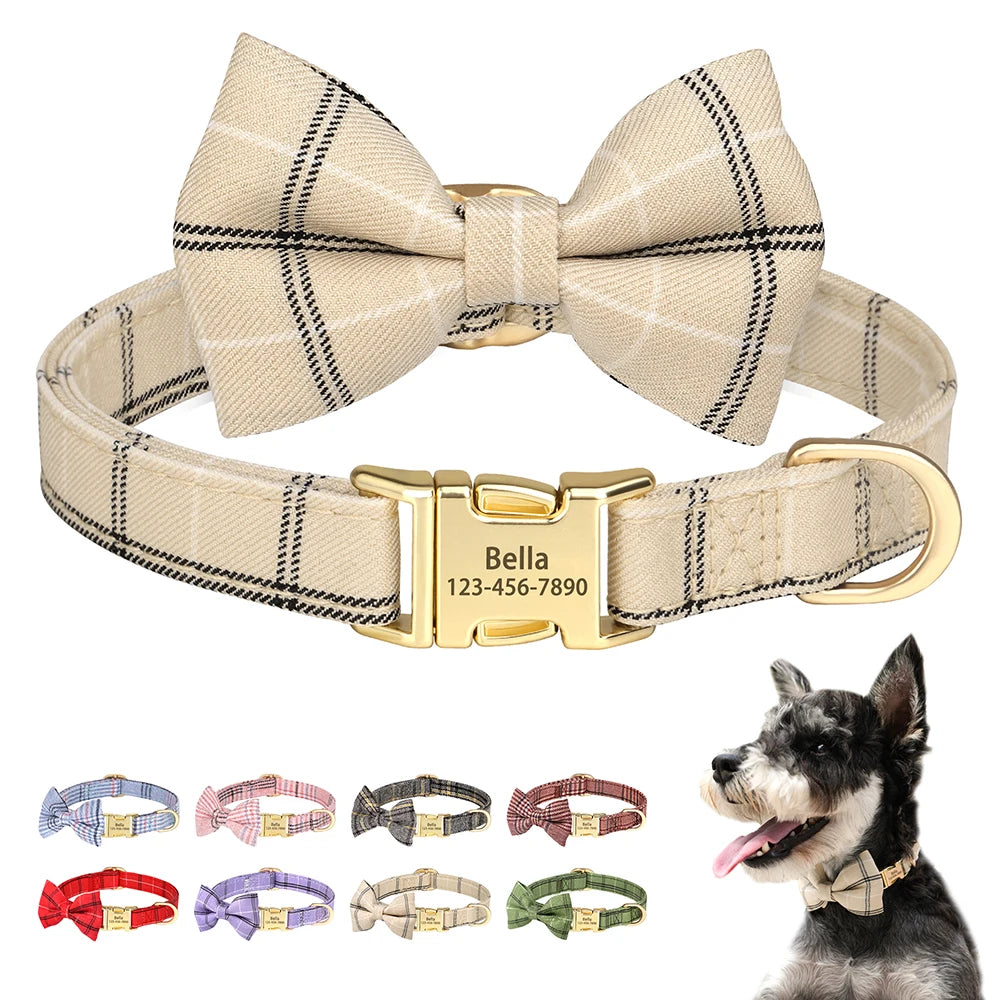 A beige and black plaid bowtie dog collar with a gold buckle and engraved nameplate.