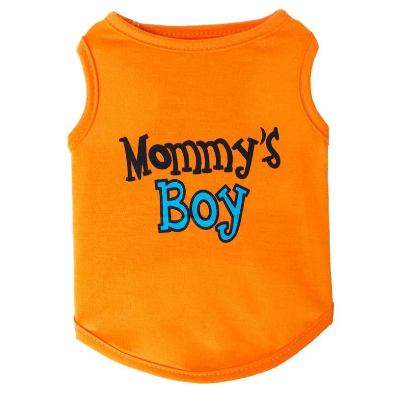 Orange sleeveless dog vest with black and blue lettering that reads Mommy's Boy
