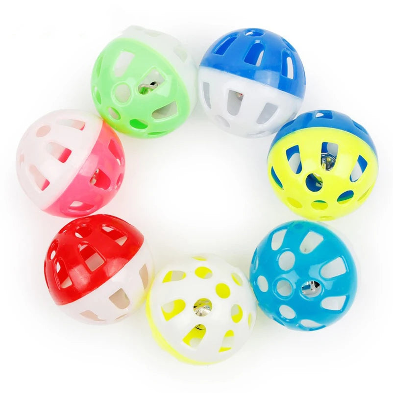 A set of ten colorful plastic cat toy balls shaped like jingle bells in various colors including green blue yellow pink and r
