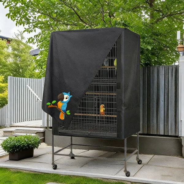 A black Oxford cloth bird cage cover with a mesh front and an orange bird inside, displayed outdoors.