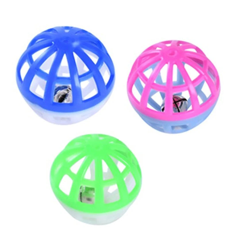 Three plastic cat ball toys in blue, pink, and green with bells