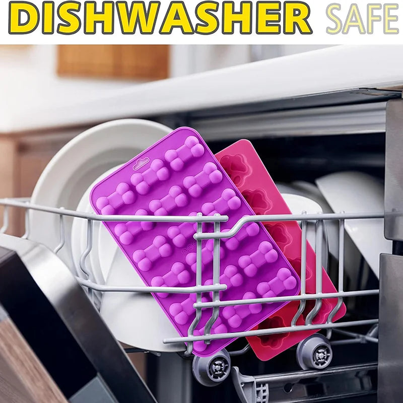 A silicone mold set for dog paw and bone treats is placed inside a dishwasher basket.