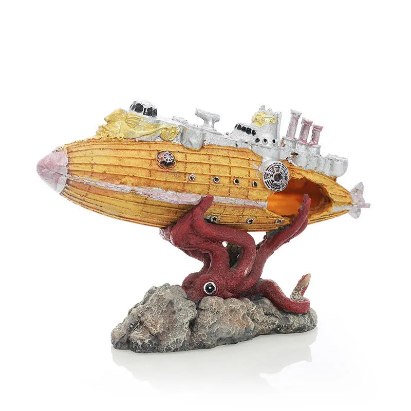 A model of a yellow submarine with a reddish creature emerging from a rock.