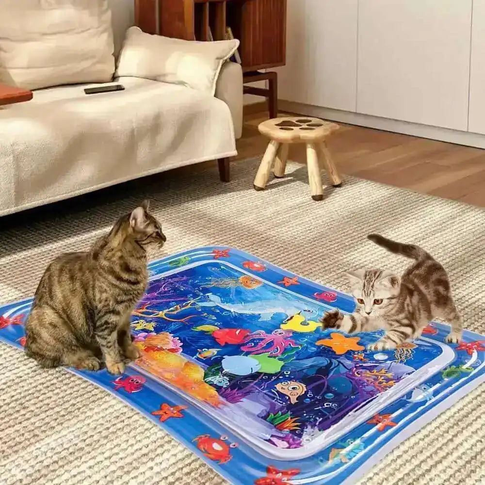 A blue and purple interactive sensory water play mat for cats and dogs lying on a beige rug.