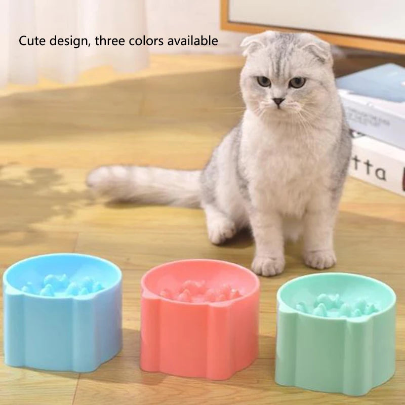 Three colored anti-choking slow feeder bowls for cats and dogs displayed on a wooden surface.
