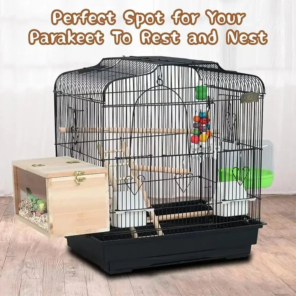 A black wire parakeet cage with a wooden viewing panel and nesting area for a bird.