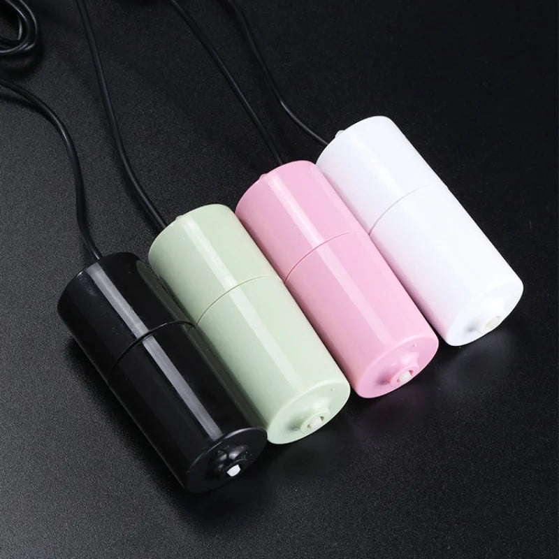 Three white and pink USB silent air pumps for aquarium oxygenation displayed on a dark surface.