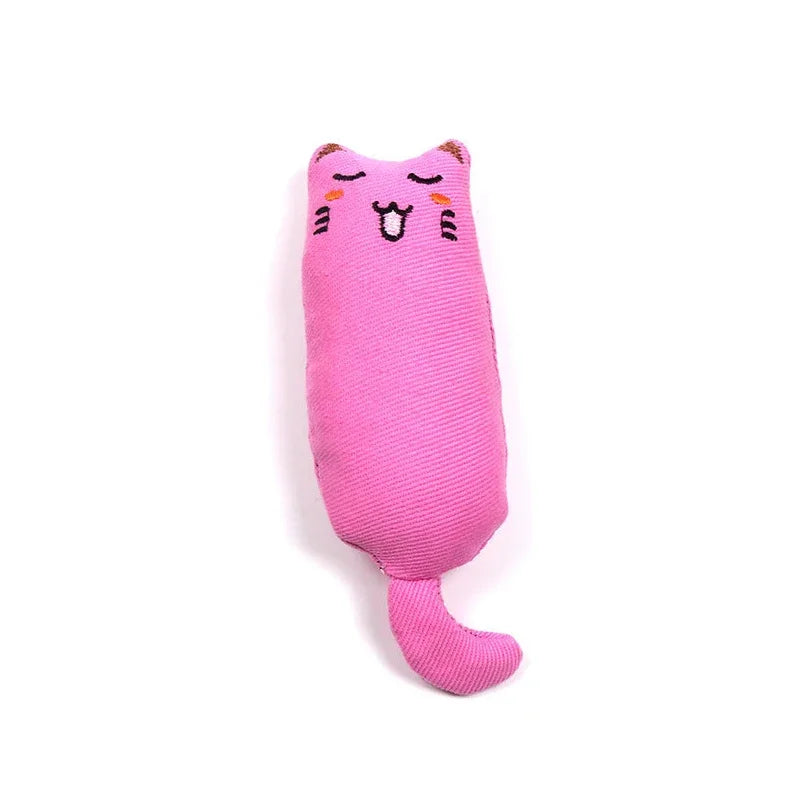A pink plush cat toy shaped like a face with ears and a soft thumb pillow design.