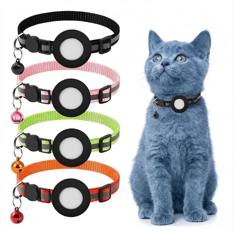A collection of black, pink, green, and orange breakaway cat collars with reflective strips and an AirTag holder displayed ne