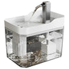 A clear automatic cat water fountain with a stainless steel spout is shown, featuring a filter and circulating water.