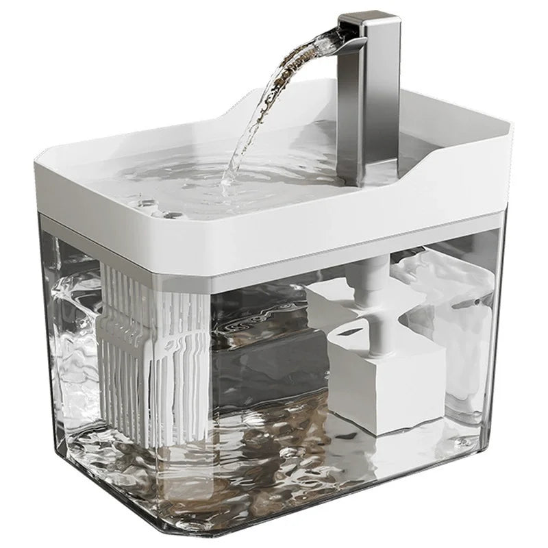 A clear automatic cat water fountain with a stainless steel spout is shown, featuring a filter and circulating water.