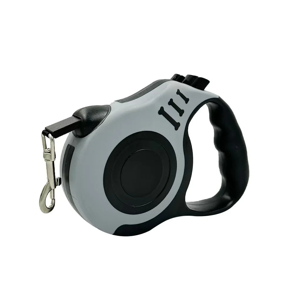 A gray and black automatic retractable dog leash with a black handle and numbered grip.