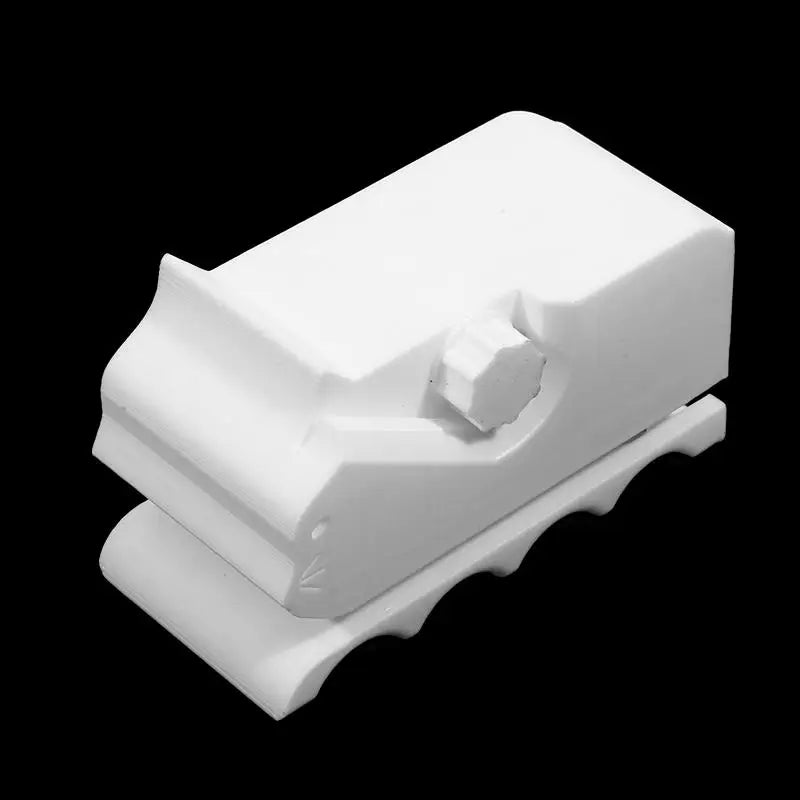White handheld cardboard strip cutter tool used for DIY projects and crafts.