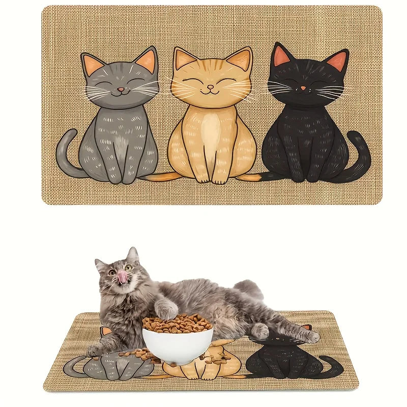 A pet feeding mat featuring three cats in shades of gray, beige, and black, with cat food scattered on the mat.