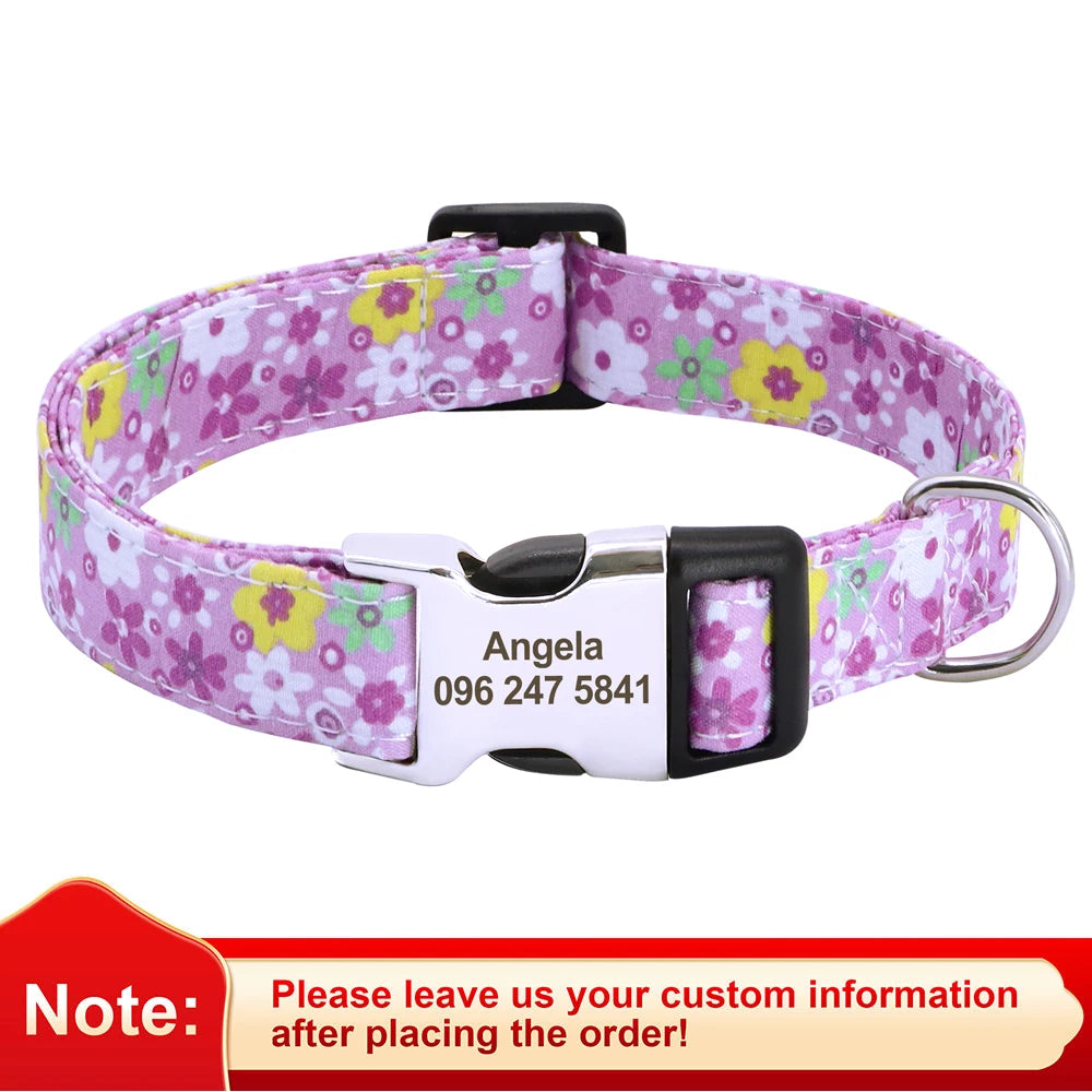 A purple floral print dog collar with a silver buckle and an engraved name tag reading Angela 096 247 5841.