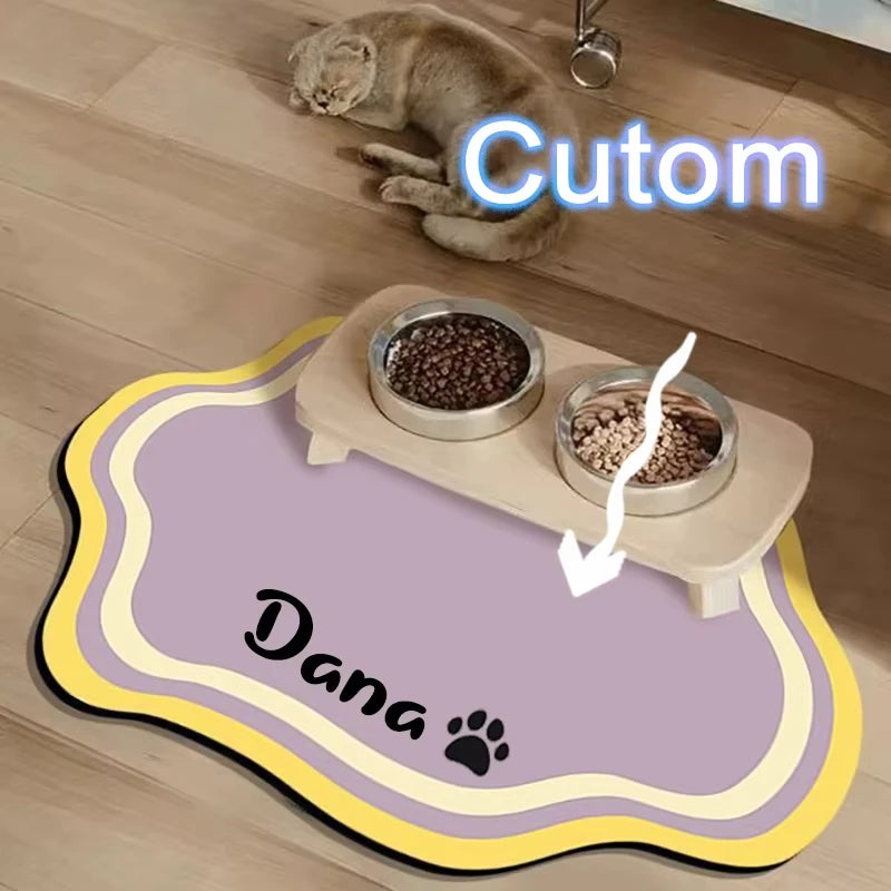 A pet feeding mat with a non-slip base and two bowls for food, featuring the word Cutom and Dana.