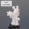 White resin coral decoration with a black base, measuring 3.5x5.4cm.