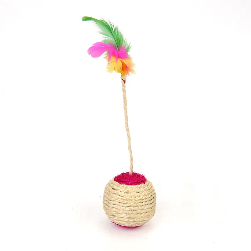 A sisal cat scratching ball toy with a pink base and a green and yellow feather top.