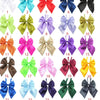 Colección de veinticinco pajaritas de satén coloridas en varios tonos, incluyendo rosa, púrpura, verde, amarillo y negro.