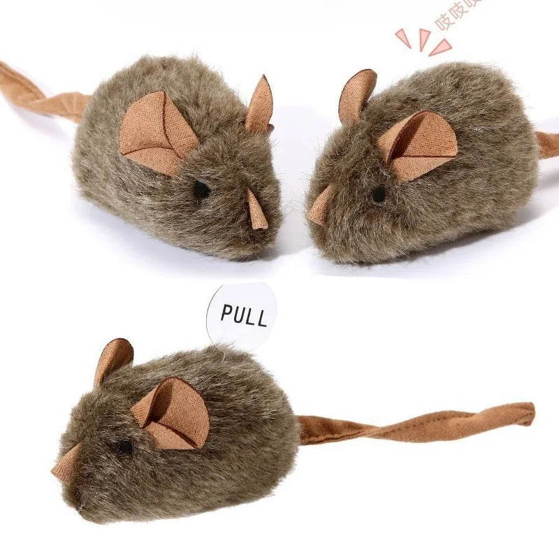 A soft gray plush toy shaped like a mouse with brown ears and a cord for interaction.