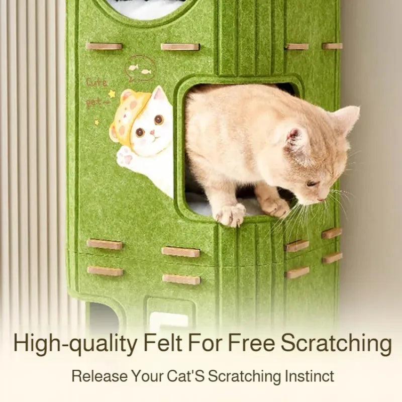 A green felt cat house with a cutout showing a small kitten resting on a scratching board.