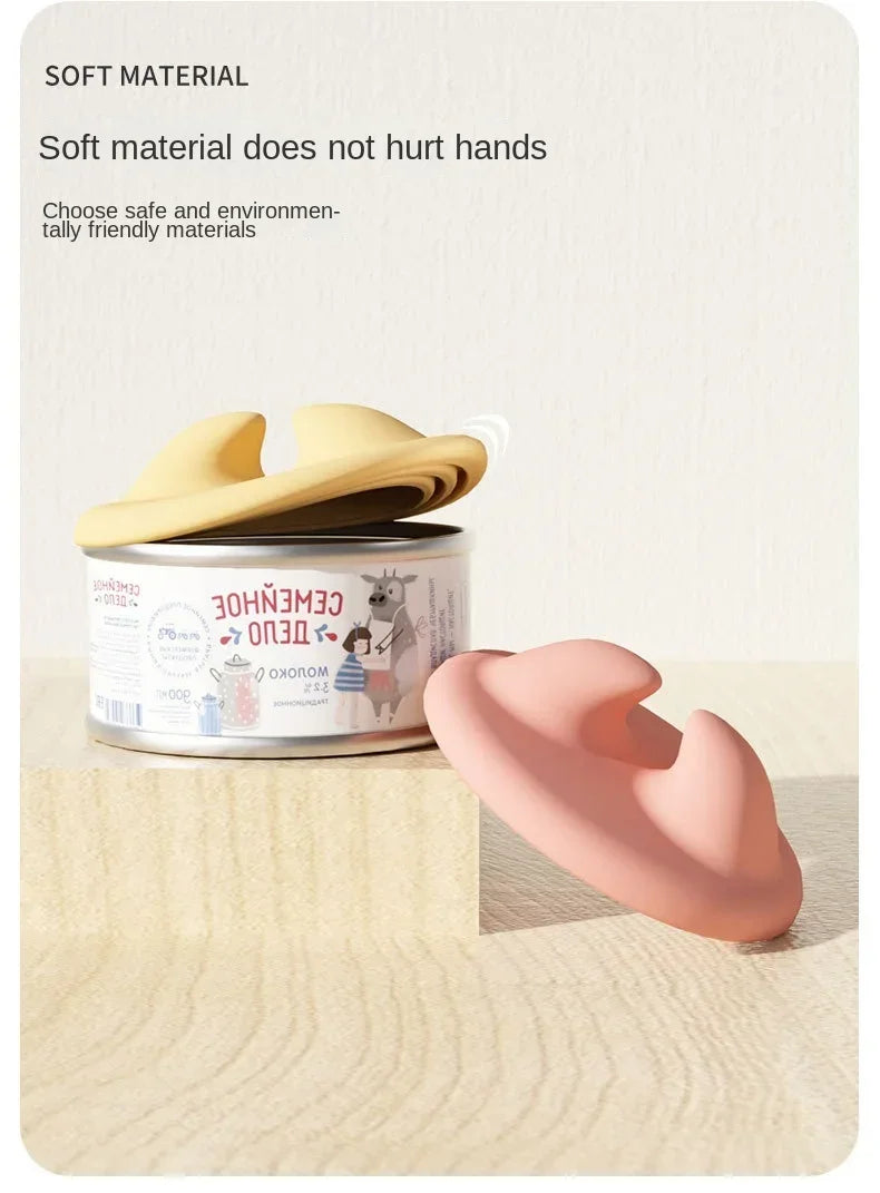 A pink silicone pet feeding spoon with a curved design is shown next to a can of food.