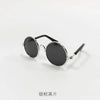 Schwarze Vintage-Tier-Sonnenbrille mit silbernen Metallarmen