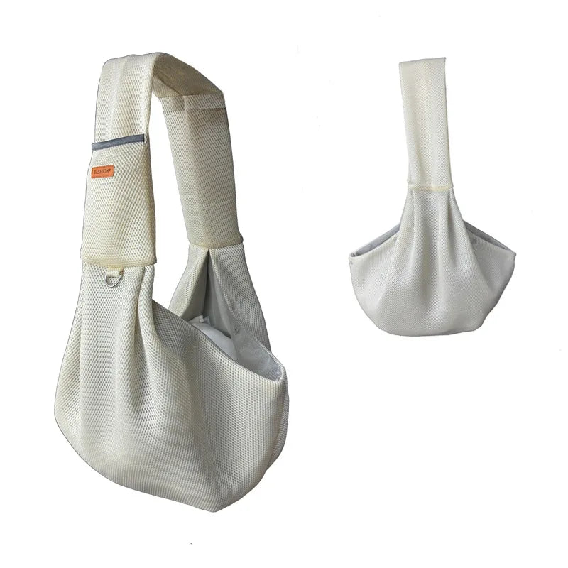 A beige breathable mesh dog carrier crossbody bag shown from the side and top view.