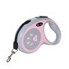 Correa retráctil de nylon rosa y gris para mascota con etiqueta adjunta.
