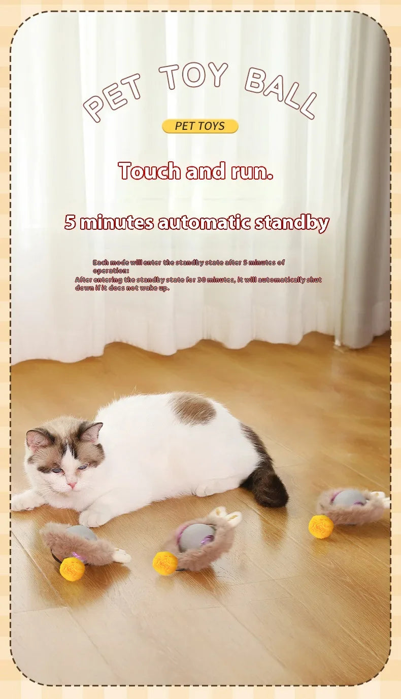 A white cat is lying next to a yellow pet toy ball on a wooden floor, with text promoting an automatic standby feature.