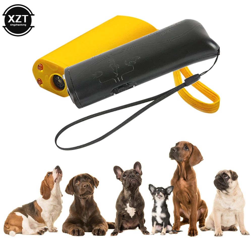 A yellow and black ultrasonic dog training device with a flexible cord and several dogs.