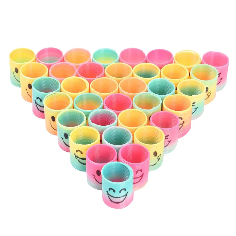 A set of twelve colorful spring coil toys in various shades of pink, yellow, and green.