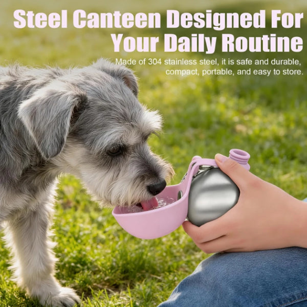 A dog is drinking water from a pink portable stainless steel bottle outdoors.