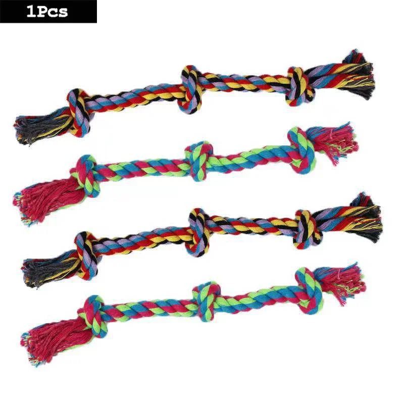 Three colorful cotton rope dog toys shaped like carrots and dumbbells