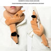 A plush toy shaped like a dachshund is shown being worn around the neck of a person.