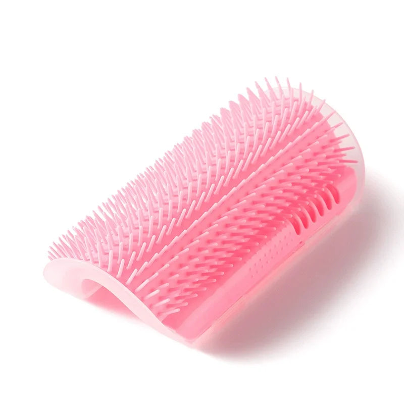 A pink cat self-grooming massage comb with a corner mount shown in profile.