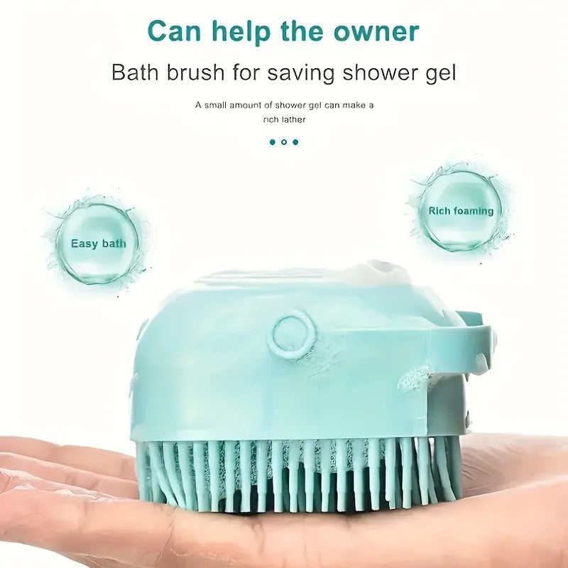 A light blue pet bath massage brush with a shower gel dispenser is shown being held in a person's hand.