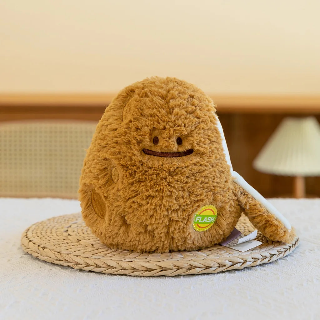A fluffy brown plush vegetable doll resembling a peanut, resting on a woven mat.