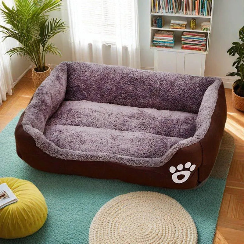 A brown dog bed with a plush, gray cushion rests on a light blue rug.