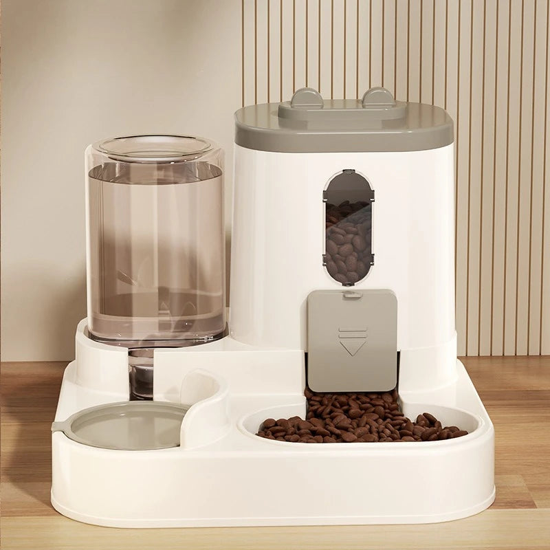 A white gravity pet food and water dispenser with a clear water tank and a compartment for dry food.